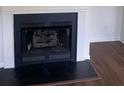A fireplace insert provides the cozy focal point of this living room at 4804 Coopers Ct, Summerville, SC 29485