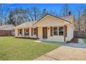 Charming single-story home features a well-manicured lawn and brick facade, complemented by wood shutters at 7783 Peppercorn Ln, North Charleston, SC 29420