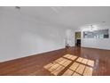 Bright living room featuring hardwood flooring, and large windows offering lots of natural light at 804 Buckthorn Cir, Summerville, SC 29483