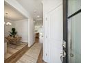 Inviting entryway with a view of the dining room and modern, open-concept kitchen at 812 Alma Square Dr, Moncks Corner, SC 29461