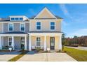 Charming townhome with covered porch and inviting entryway at 812 Alma Square Dr, Moncks Corner, SC 29461