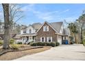 Spacious two-story home boasts classic architectural details and a long driveway at 8615 Arthur Hills Cir, North Charleston, SC 29420