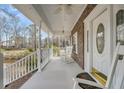 Spacious front porch with ceiling fan offers ample space for seating and relaxation at 8615 Arthur Hills Cir, North Charleston, SC 29420