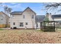 Expansive backyard view showing house elevation, patio, and lawn at 113 Hartley Hall Ct, Summerville, SC 29485
