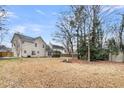 Wide-open backyard with trees, lawn, and patio at 113 Hartley Hall Ct, Summerville, SC 29485