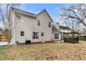A spacious backyard with a pergola, mature trees, and lawn at 113 Hartley Hall Ct, Summerville, SC 29485