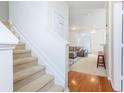 Bright, inviting interior featuring a staircase leading to a living area with comfortable seating and natural light at 130 River Landing Dr # 6207, Charleston, SC 29492
