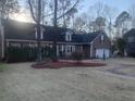 Charming home featuring a well-manicured lawn, dormer windows and a two-car garage at 132 Hidden Fawn Cir, Goose Creek, SC 29445