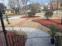 Well-manicured front yard with a stone walkway, mature landscaping and colorful mulch at 132 Hidden Fawn Cir, Goose Creek, SC 29445
