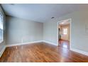 Open-concept living room featuring polished hardwood floors and bright light at 1556 Larry St, North Charleston, SC 29405