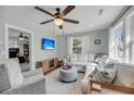 Bright living room boasts a comfortable sectional sofa, ceiling fan, and streaming tv at 17 Anita Dr, Charleston, SC 29407