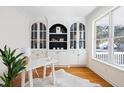 Stylish office with custom built-in shelving, hardwood floors, and bright natural light at 184 Scott St, Daniel Island, SC 29492