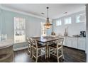 Bright dining area with modern chandelier and neutral color palette at 1945 Hubbell Dr, Mount Pleasant, SC 29466