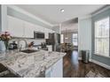 Modern kitchen featuring granite countertops, stainless steel appliances, and an open layout at 1945 Hubbell Dr, Mount Pleasant, SC 29466