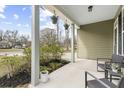 Spacious front porch with hanging plants and cozy seating, perfect for enjoying the outdoors at 2005 Nitsa St, Johns Island, SC 29455