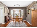 Cozy dining room with a bay window, hardwood floors, and elegant light fixtures at 2080 Bancroft Ln, Mount Pleasant, SC 29466