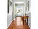 Welcoming entryway with hardwood floors, an arched doorway, and decorative elements at 2080 Bancroft Ln, Mount Pleasant, SC 29466