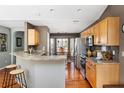 Open kitchen featuring wood cabinets, granite countertops, and modern stainless steel appliances at 2080 Bancroft Ln, Mount Pleasant, SC 29466