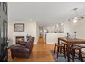 Inviting living room with a fireplace, dining table, and open kitchen with modern appliances at 47 Drake St, Charleston, SC 29403