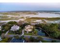 Expansive aerial view showcases home's waterfront location, pond, and neighborhood at 4935 Sound View Dr, Mount Pleasant, SC 29466