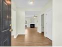 Welcoming entryway featuring hardwood floors and a view into a spacious living room with a fireplace at 506 Cecilia Cove Dr, Charleston, SC 29412