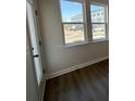 Bright bedroom with wood flooring, double windows and a door at 5122 Double Eagle, Summerville, SC 29485