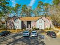 Well-maintained two-story condo building with ample parking spaces available for residents and guests at 7930 Timbercreek Ln # C, North Charleston, SC 29418