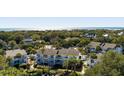 Beautiful aerial shot of the community, showcasing the ocean view and lush green surroundings at 8 Lagoon Villas, Isle of Palms, SC 29451