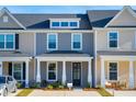 Attractive townhome featuring a covered porch and updated facade at 814 Alma Square Dr, Moncks Corner, SC 29461