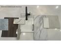 Modern farmhouse design featuring a sample of textures and materials like marble, wood, tiles, and white painted cabinets at 816 Alma Square Dr, Moncks Corner, SC 29461