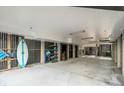 Spacious garage with ample room for storage and recreational equipment, surfboard, and beach chairs at 9 J C Long Blvd, Isle of Palms, SC 29451