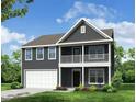 Beautiful two-story home with a covered porch, a two car garage, and professionally landscaped yard at 121 Palfrey Dr, Ridgeville, SC 29472