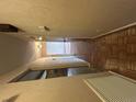 Hallway featuring parquet floors and neutral wall paint leading to a door at the end of the hall at 125 Three Wood Ln, Summerville, SC 29483