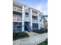 Exterior view of the building with balconies, white railings, and mature landscaping at 1300 Park West Blvd # 420, Mount Pleasant, SC 29466