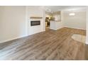 Spacious open floor plan with hardwood floors and modern electric fireplace feature at 1300 Park West Blvd # 420, Mount Pleasant, SC 29466