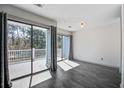 Balcony with sliding glass doors and wooded view at 1714 Greystone Blvd # 47, Mount Pleasant, SC 29464