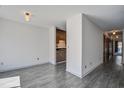 Hallway with view into kitchen and wood-style flooring at 1714 Greystone Blvd # 47, Mount Pleasant, SC 29464