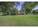 Beautiful brick home with a well-maintained lawn and mature trees in the front yard at 1758 Mendel Rivers Rd, Saint Stephen, SC 29479