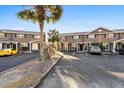 Exterior view of townhomes with parking featuring well maintained grounds and mature landscaping at 1860 Mepkin Rd # H1, Charleston, SC 29407