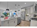 Bright, open kitchen featuring a large island with sink and stainless steel appliances at 2322 Watchtower Ln, Charleston, SC 29414