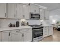 Modern kitchen with stainless steel appliances, white cabinets, and subway tile backsplash at 2322 Watchtower Ln, Charleston, SC 29414
