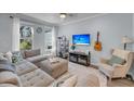 Cozy living room with plush sectional, natural light and stylish decor elements at 2322 Watchtower Ln, Charleston, SC 29414