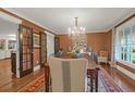 Beautiful dining room with chandelier, rich wall covering, and access to the kitchen at 299 Hobcaw Dr, Mount Pleasant, SC 29464