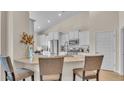 Modern kitchen with white cabinets, granite countertops, stainless steel appliances, and bar seating at 334 Pine Crest View Dr, Summerville, SC 29486