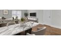 Dining room with a marble table and views of the living room at 402 Andrea Ln, Hanahan, SC 29410