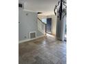 Entryway with beautiful tile floors, wooden staircase and exterior view at 604 Ventura Pl, Mount Pleasant, SC 29464