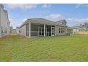 Expansive backyard featuring a screened porch, perfect for outdoor relaxation at 5213 Cottage Lndg Dr, Summerville, SC 29485