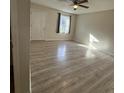 Bright bedroom featuring new laminate flooring, a window and ceiling fan at 6983 Vista Ct, North Charleston, SC 29406