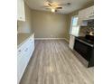 Eat-in kitchen features stainless steel appliances, mosaic backsplash and new laminate flooring at 6983 Vista Ct, North Charleston, SC 29406