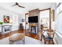 Living room with a decorative brick fireplace and hardwood floors at 1 Percy St, Charleston, SC 29403